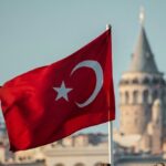 Turkish flag waving with Galata Tower in the background, symbolizing Turkey’s 5G spectrum auction 2025 and digital transformation