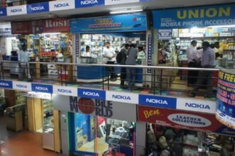 Mobile phone shops in a market in Kochi
