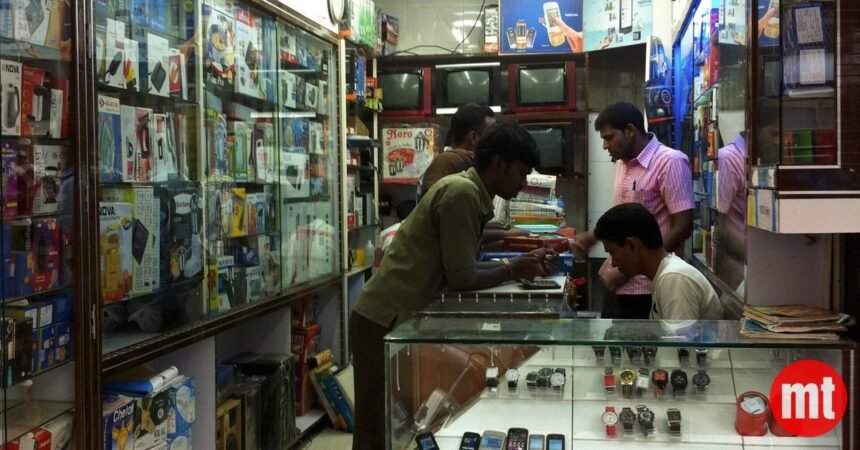 Airtel vs Jio Pricing War Slashes India's ARPU 3x Below Global Peers Inside a mobile phone shop in Mumbai